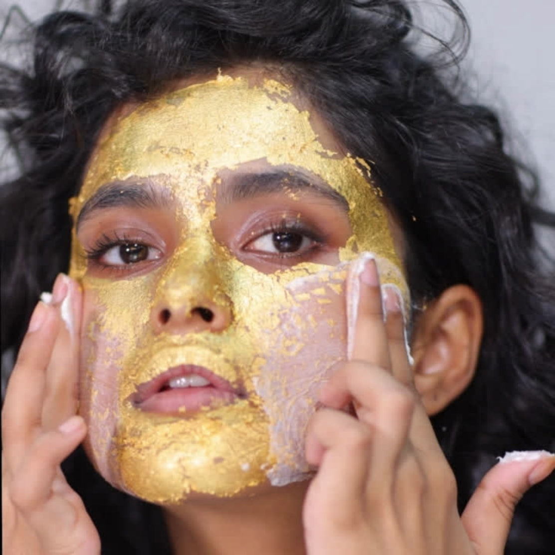 Model applying GOld Leaf mask on her face by HOB India - Old Product Image