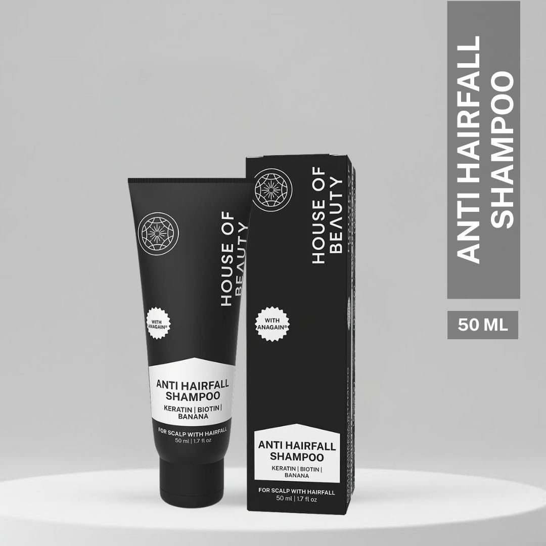 Compact 50ml House of Beauty Anti Hairfall Shampoo tube with matching box packaging on a minimalist grey display.