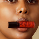 Model holding Lip Corrector Serum by HOB India - Old Product Image