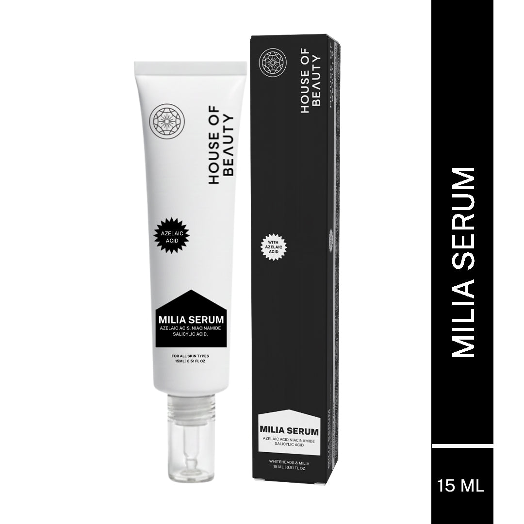 “White tube labeled House of Beauty Milia Serum placed next to its black product box.”