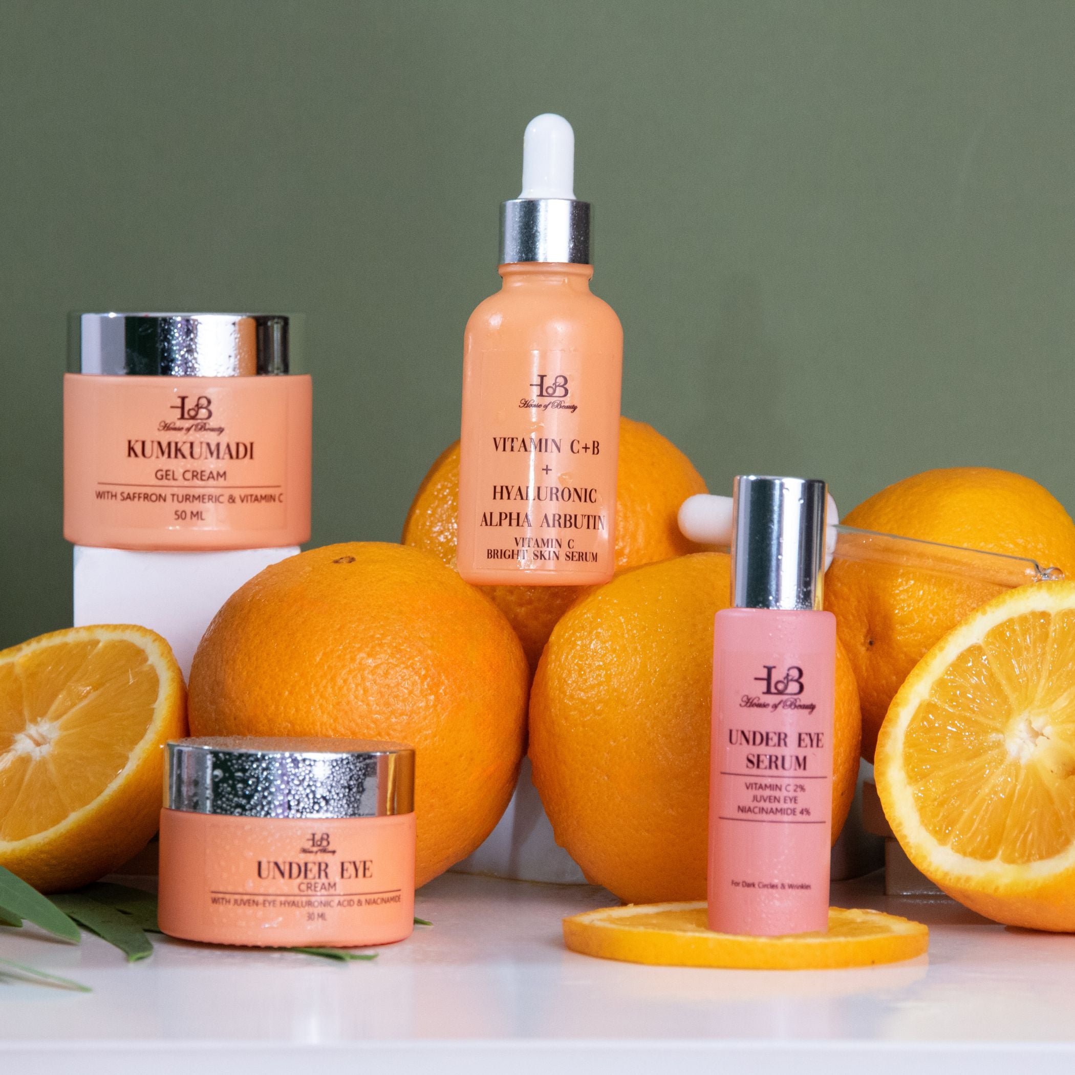 Brightening skin bottles with vitamin C, Kumkumadi and oranges for skin glow