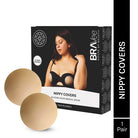 A product shot of a black box for "NIPPY COVERS SILICONE COVER MEDICAL GRADE," by BRAVEE HOUSE OF BEAUTY, showing the covers are "50 TIMES REUSABLE." The box features a model wearing the covers under a bra. A pair of beige nipple covers is displayed next to the box.