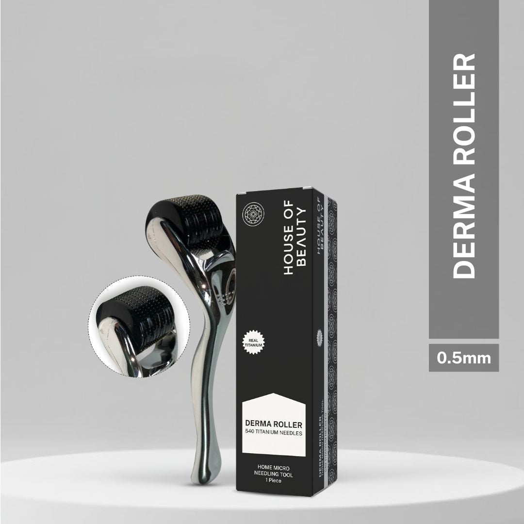Black House of Beauty 0.5mm derma roller with 540 titanium needles displayed beside branded packaging on a grey background.