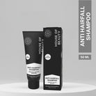 Compact 50ml House of Beauty Anti Hairfall Shampoo tube with matching box packaging on a minimalist grey display.