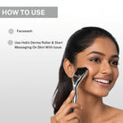 Woman demonstrating how to use the House of Beauty derma roller on the cheek after cleansing the face as part of a skincare routine.